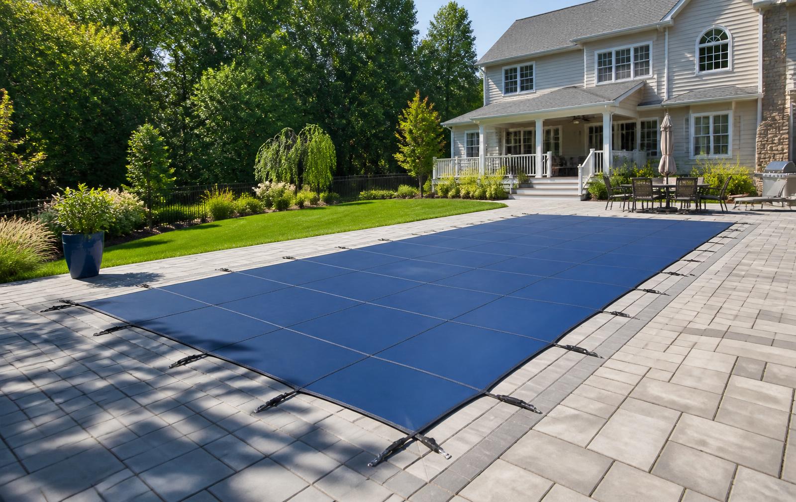 Backyard swimming pool at a New Jersey home covered with a fitted safety pool cover